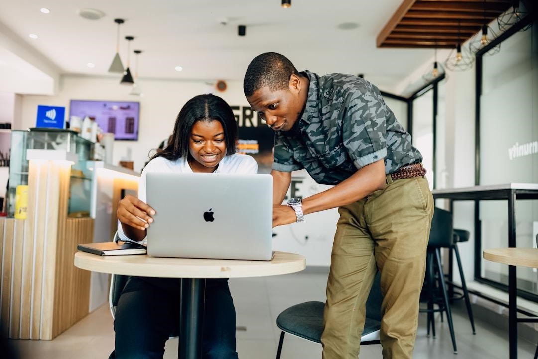 Two professionals are exploring AI knowledge platforms to ensure the integrity and accuracy of stored information over time