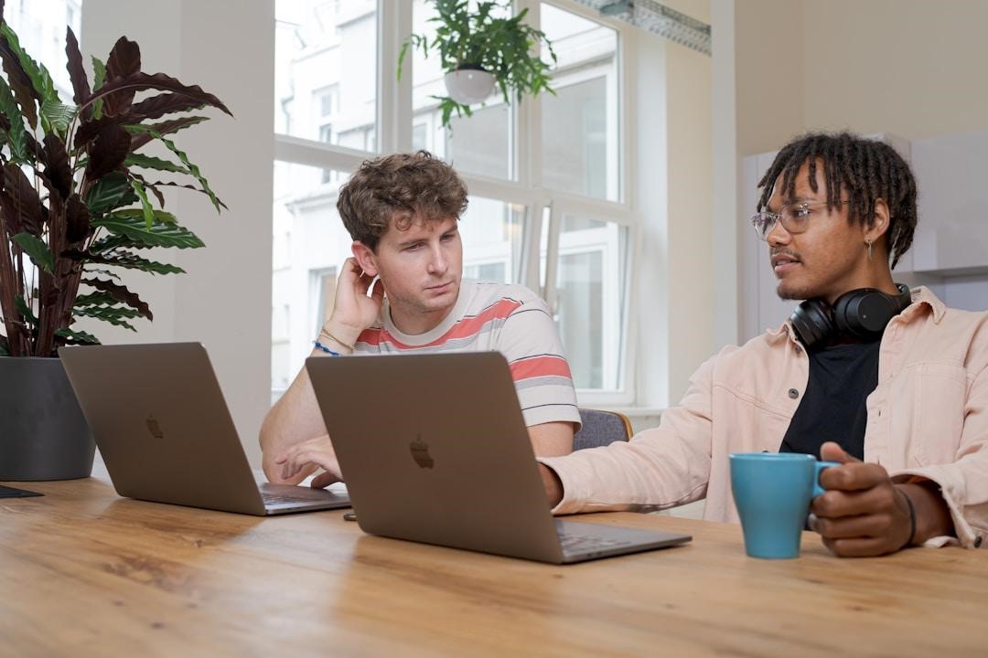 Two employees discussing the role of Natural Language Processing in enhancing AI knowledge management